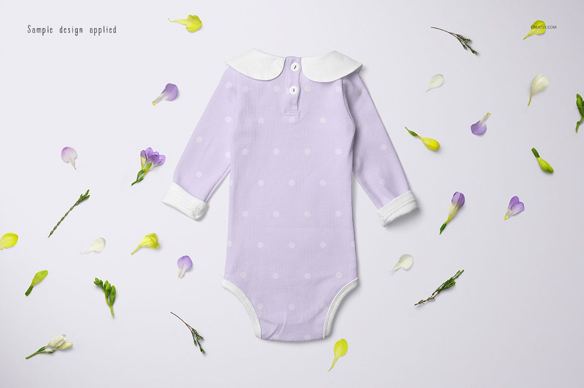 Long-sleeve baby romper mockup in light purple with white polka dots, shown from above on a white surface.