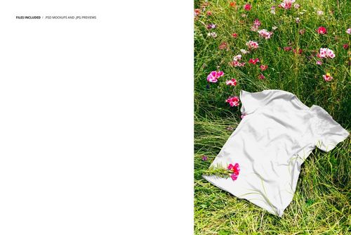 White adult t-shirt lying flat on a green meadow with pink and white flowers, viewed from above in a mockup scene.