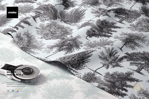 Layered fabric mockup featuring a black and white tree pattern on soft textile, shown from a front angled view.