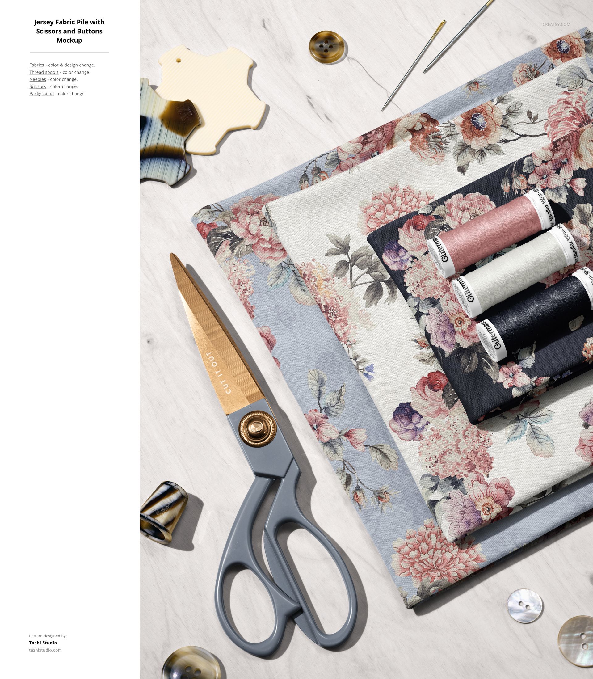 PSD mockup featuring folded jersey fabric with flower designs, surrounded by sewing accessories on a pale tabletop.