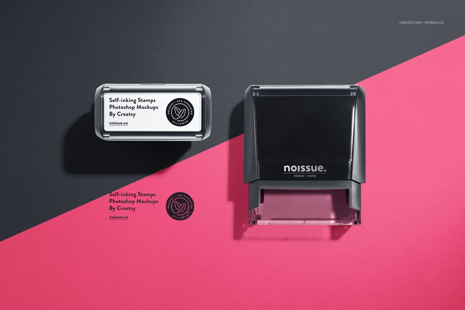 Mockup of self-inking stamps featuring black and clear plastic, arranged on a contrasting pink and gray surface.
