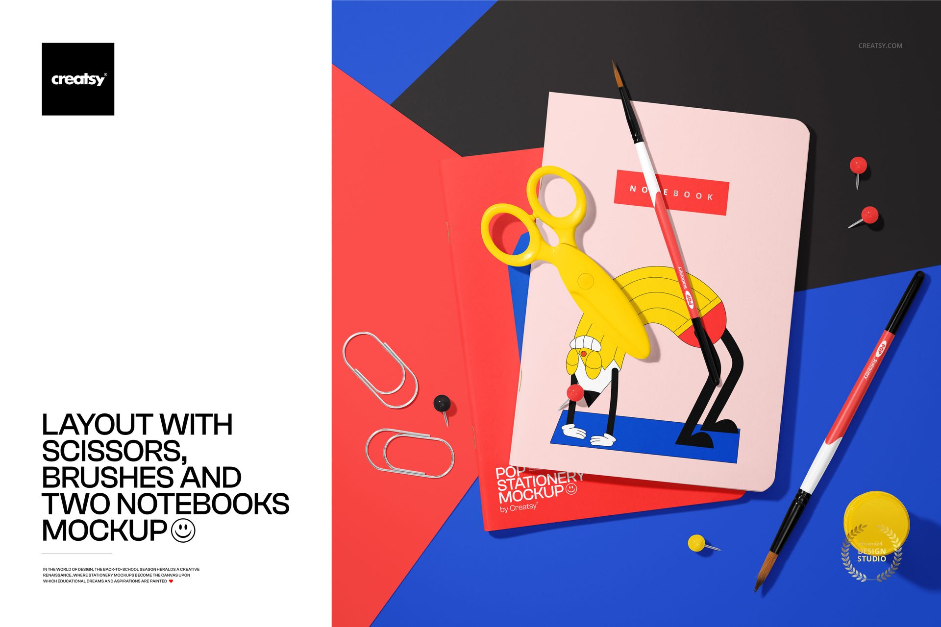 Stationery mockup featuring two notebooks, scissors, brushes, and paperclips arranged neatly on a vibrant blue background.