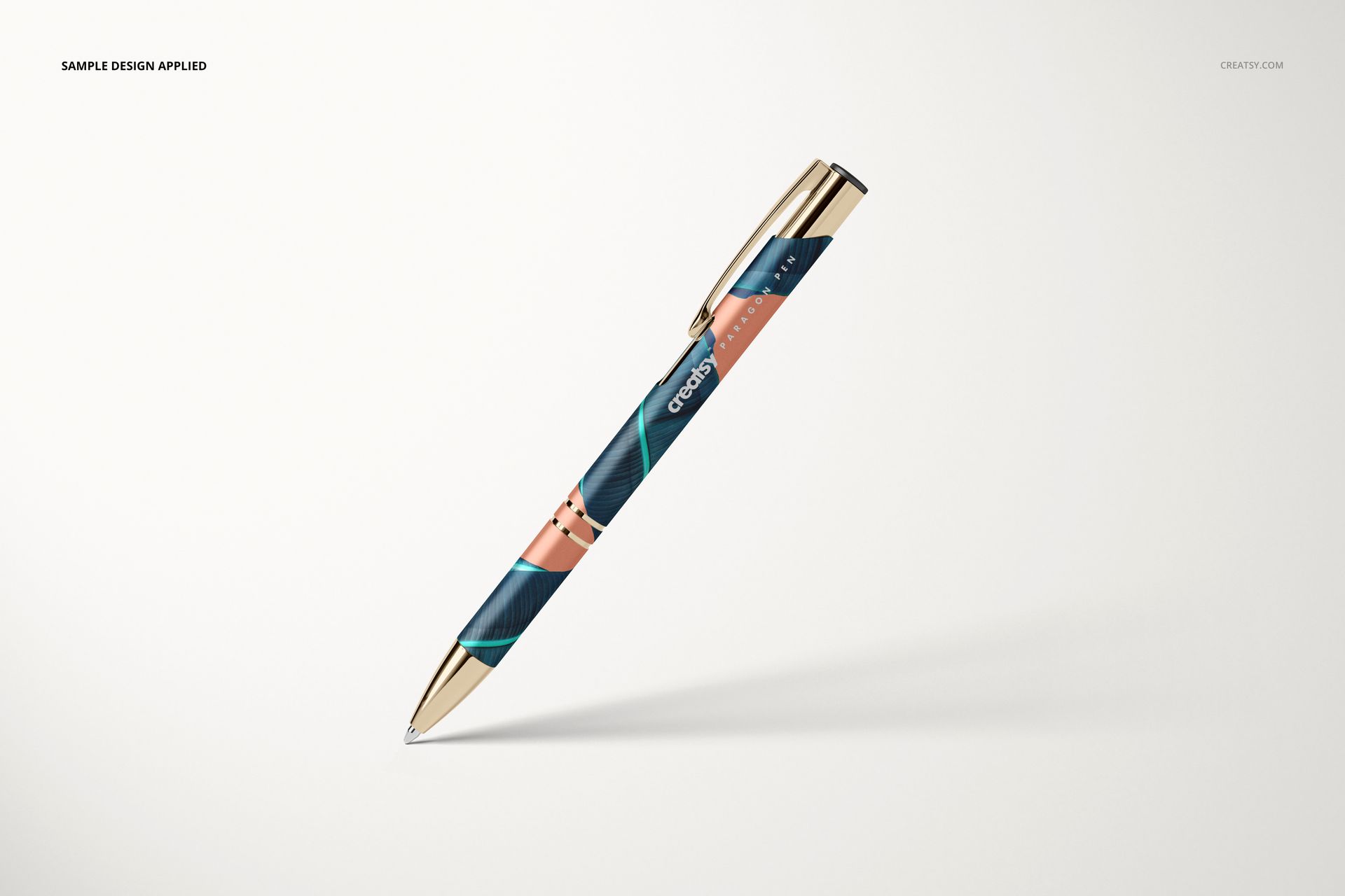 Single pen mockup with metallic gold clip and tip, decorated with abstract stripes in dark blue and coral hues.