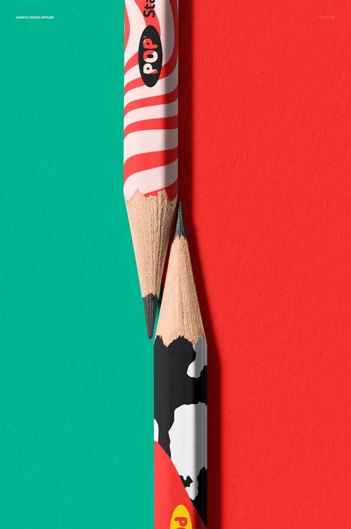Two pencils mockup shown in a close-up, featuring colorful patterns and positioned on red and teal textured surfaces.
