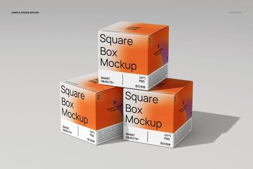 Front view of three square box mockups with bold orange and white colors, set against a neutral gray background.