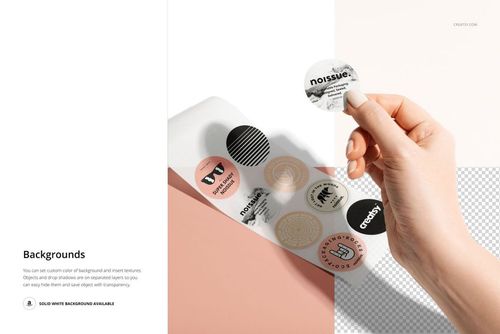 Round sticker mockup showing a hand removing a label from a sheet with several colorful circle stickers on a white surface.