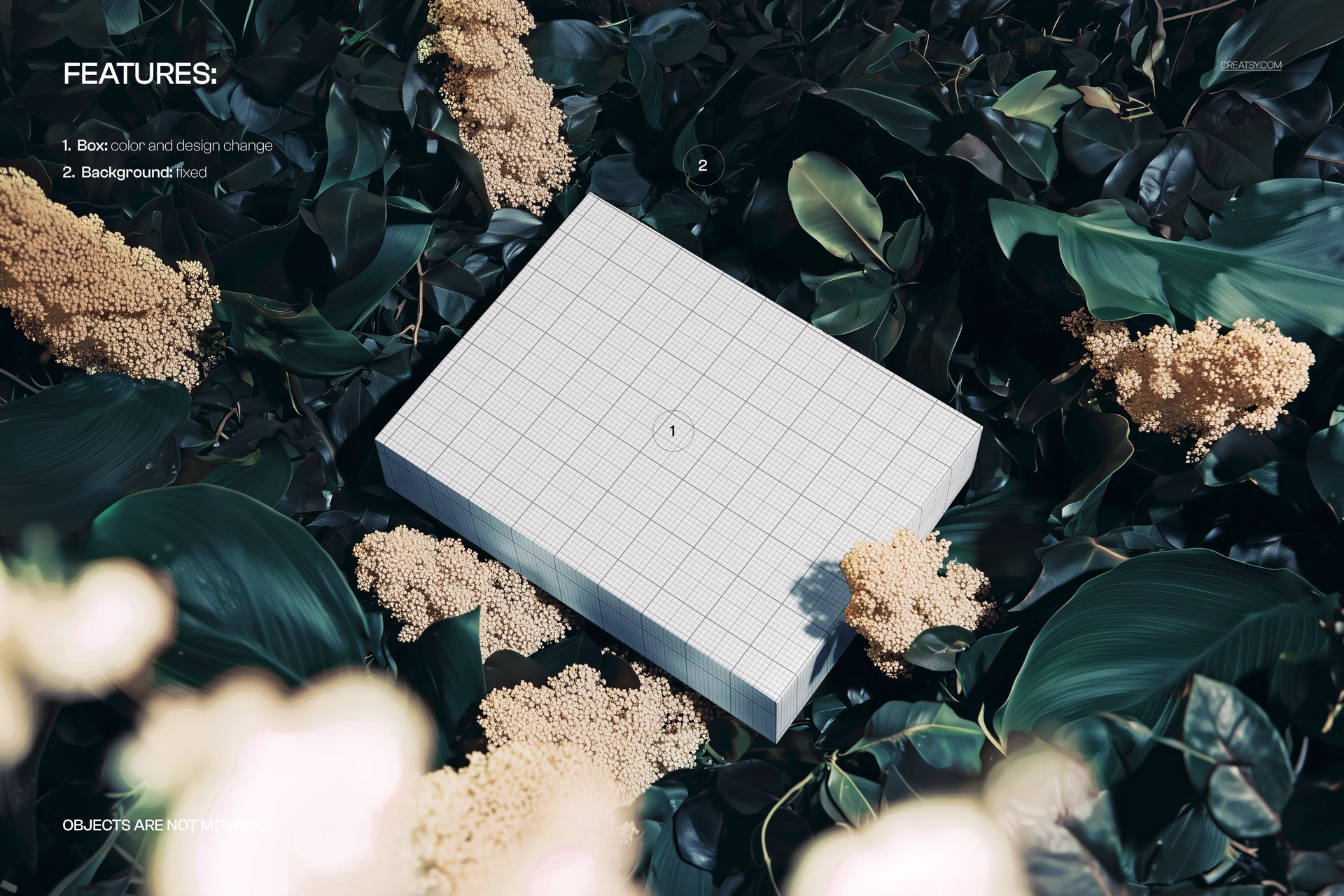 PSD mockup of a rectangular box placed among lush green foliage and clusters of small white flowers, viewed from above.