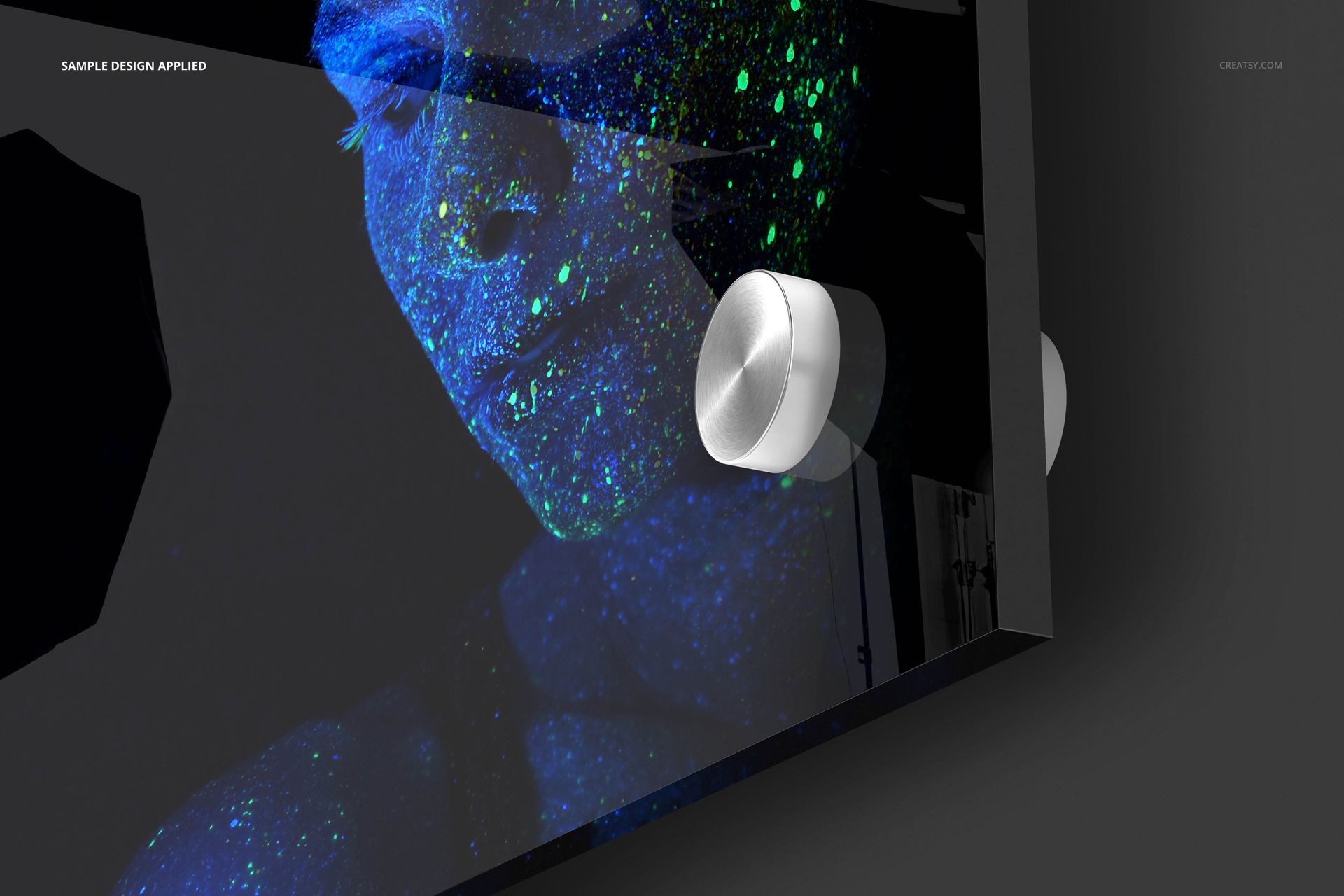 Close-up view of a rectangular acrylic print mockup featuring a portrait with blue and green glowing patterns.