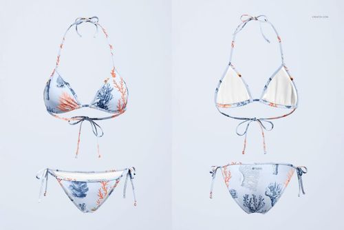 Front view of a bikini mockup set with a blue and orange coral reef pattern on a light background, displayed on a plain surface.