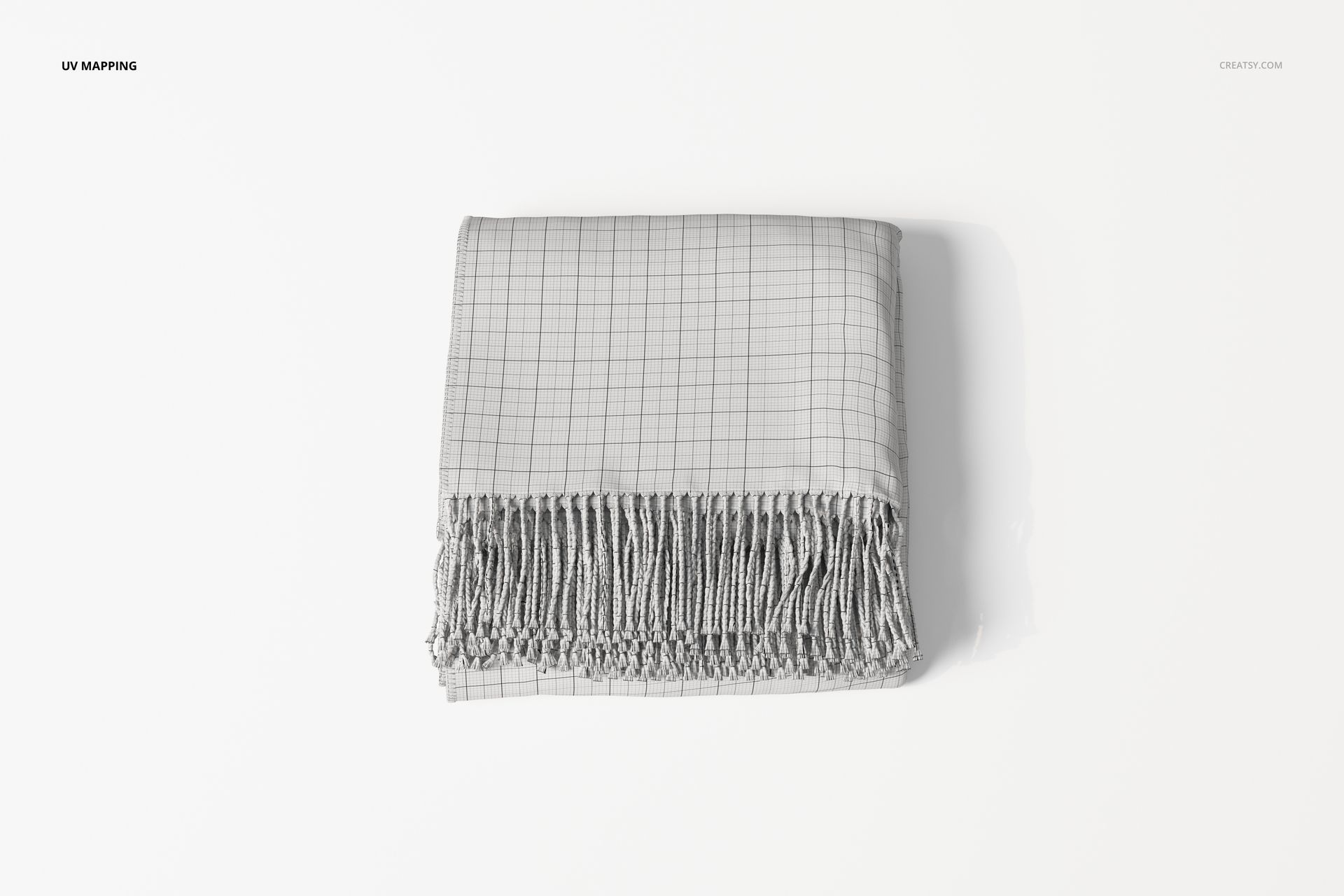 Folded throw blanket with a grid pattern and fringed edges, displayed from a top view on a white background.