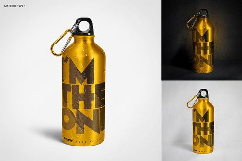 Front view of a gold aluminum water bottle mockup with large black lettering and a silver carabiner, displayed on white and concrete backgrounds.