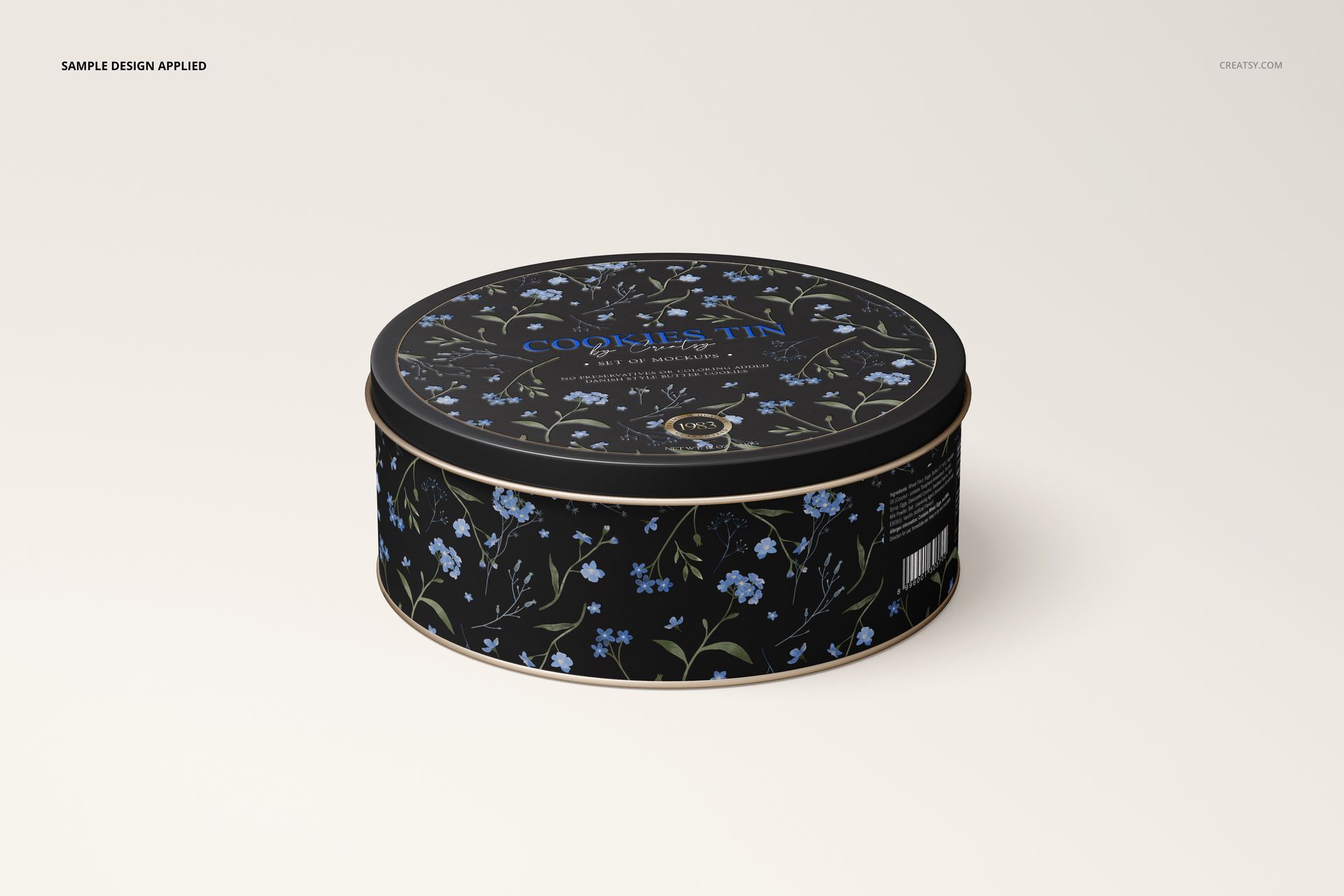 Floral-patterned round cookie tin mockup in black and blue, displayed at a slight angle on a neutral surface.