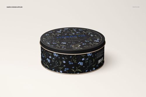 Floral-patterned round cookie tin mockup in black and blue, displayed at a slight angle on a neutral surface.