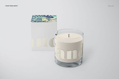 Classic candle mockup featuring a transparent glass jar and white candle, next to a box with botanical design.