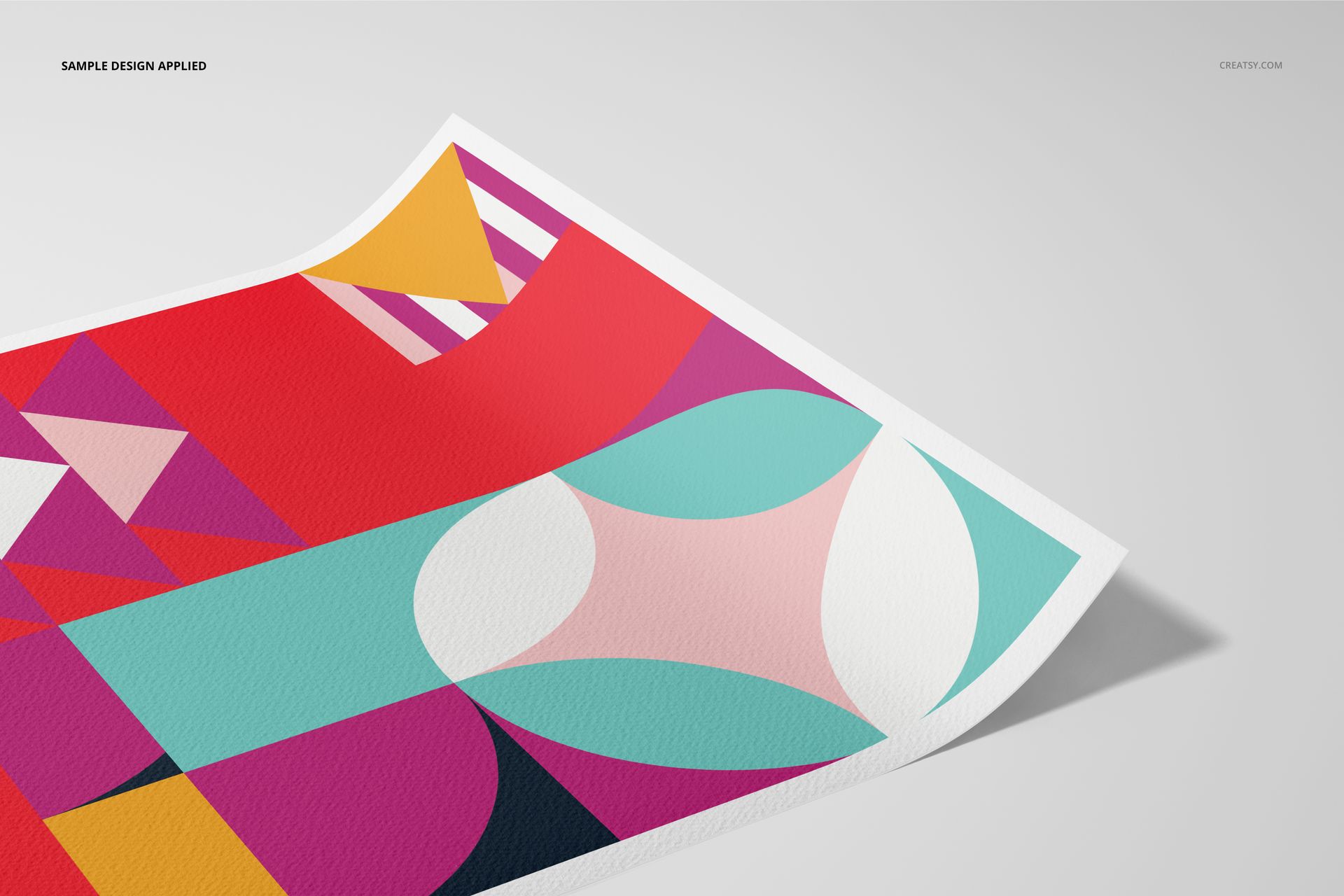 A3 fine art print mockup featuring a colorful geometric abstract pattern on textured paper, angled view.