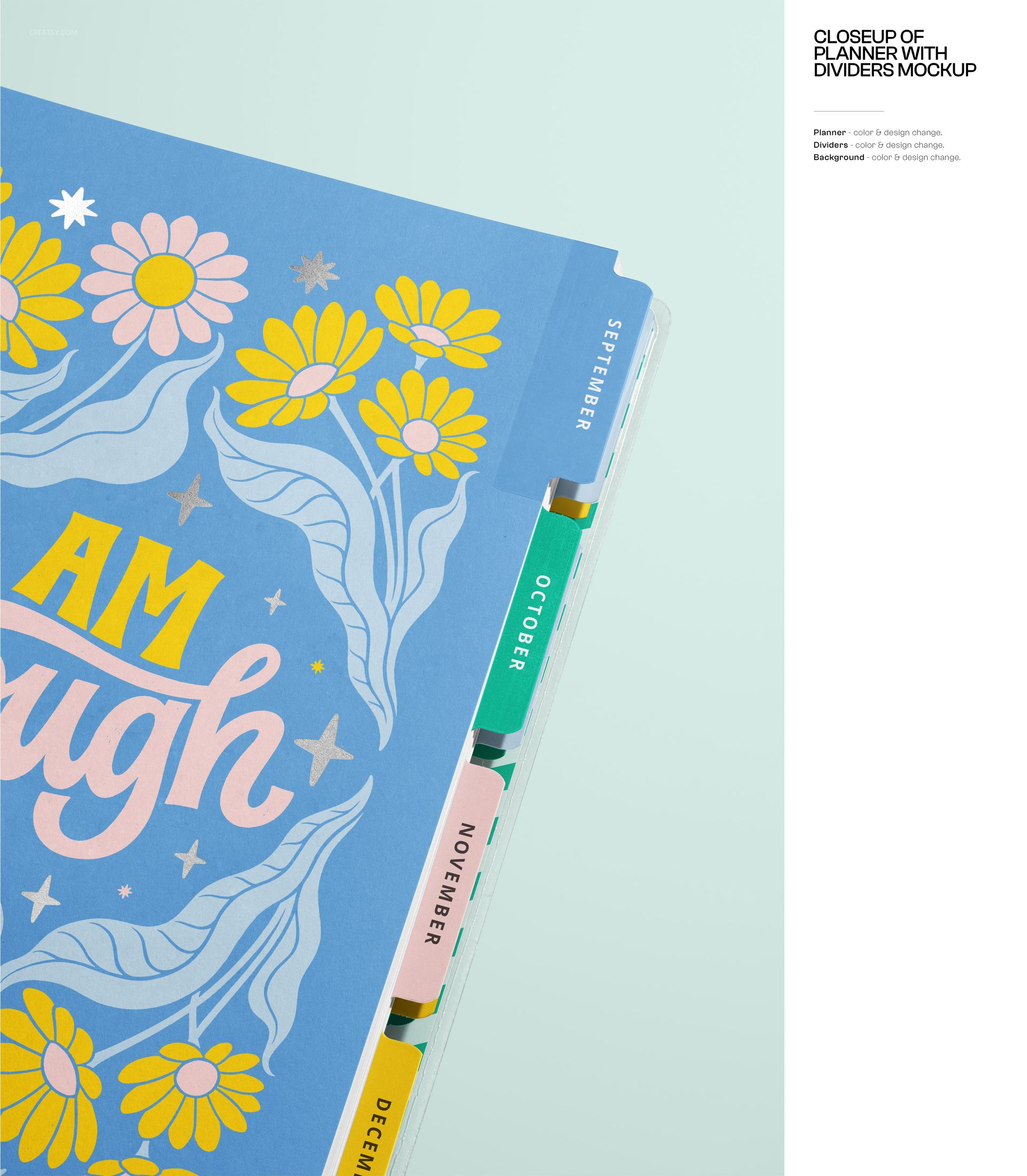 Partial front view of a stationery planner mockup featuring a blue cover, floral design, and colored monthly tabs.
