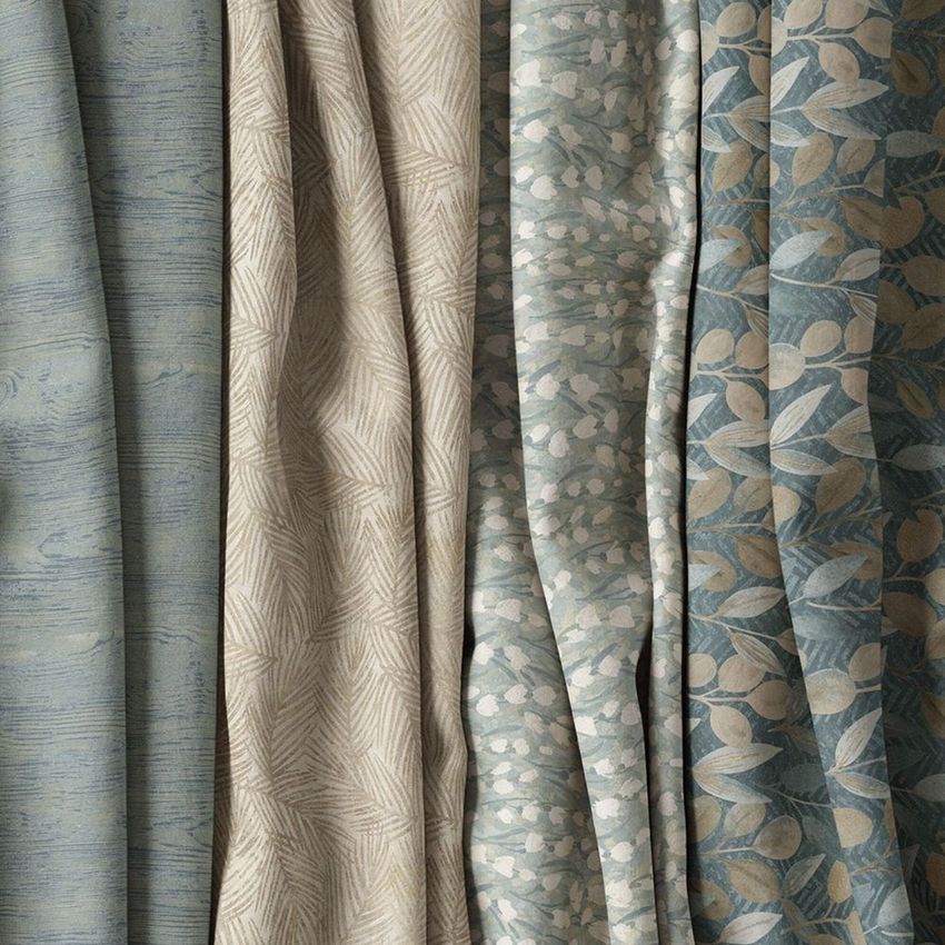 Creased fabrics mockup showing four hanging fabric panels with distinct botanical and abstract patterns in neutral blue and beige tones.