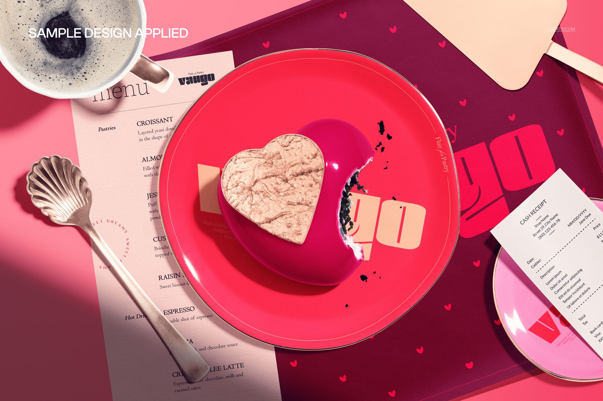 Heart shaped mousse cake on a pink plate, surrounded by a menu, spoon, tray, and coffee cup in a top view scene.