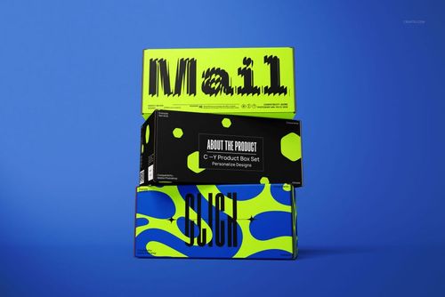 PSD mockup of packaging boxes with graphic text and abstract neon yellow patterns, arranged on a blue surface.
