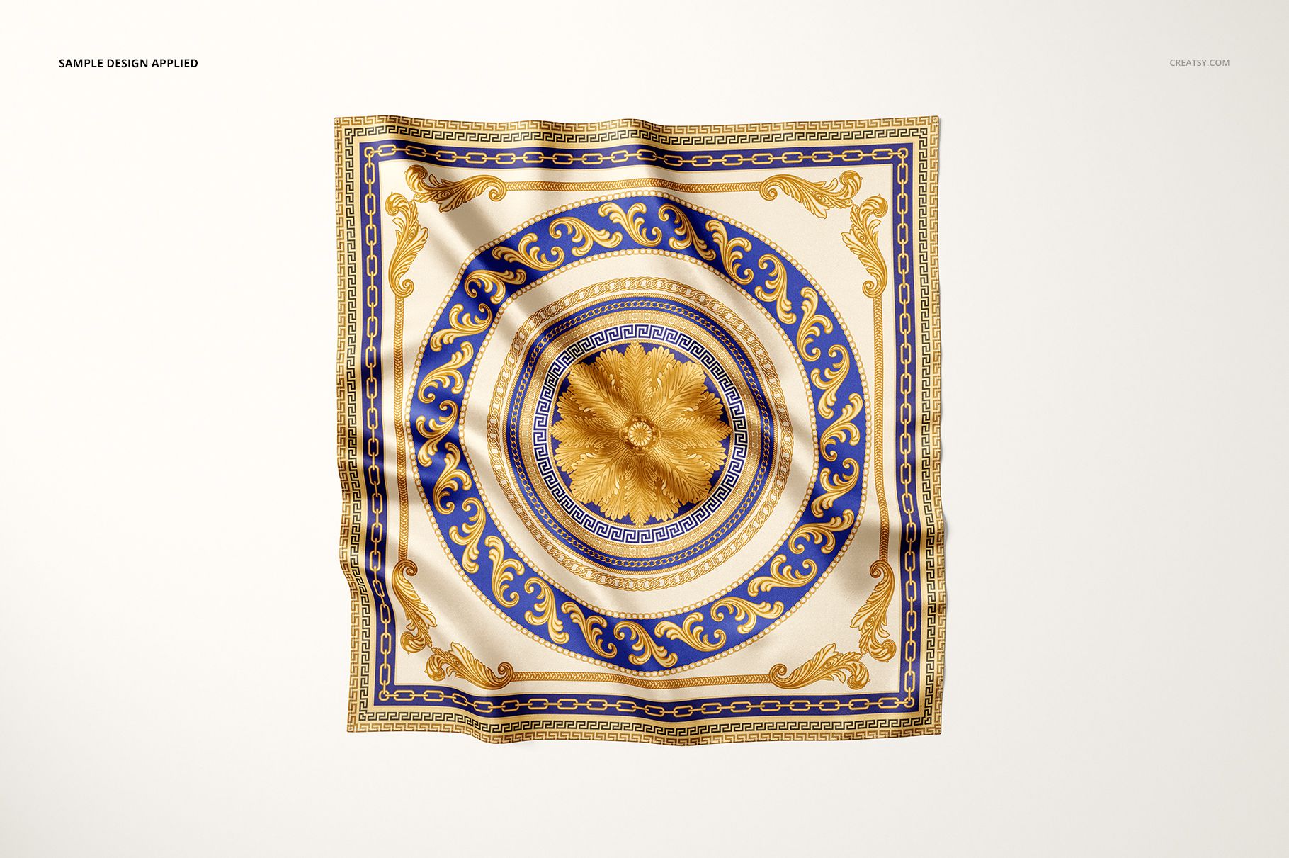 Satin scarf mockup featuring a detailed circular motif in gold and blue, displayed flat on a neutral surface.