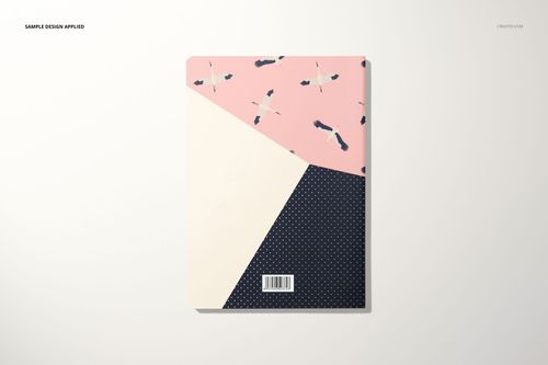 A5 notebook mockup with a geometric cover design in pink, cream, and navy blue, featuring flying bird illustrations.
