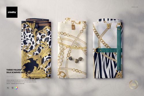 Folded silk scarves mockup showing three scarves with baroque, chain, and zebra designs on a neutral background.