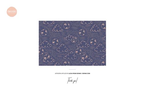 Rectangular mockup scene showing a seamless pattern of clouds and moons in peach on a navy blue background, front view.