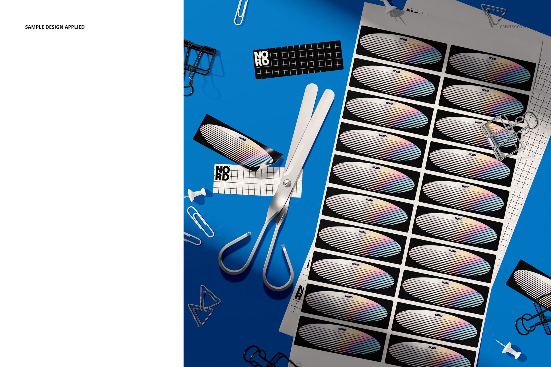 Top view of a rectangular sticker mockup set featuring multiple stickers with geometric designs on a blue surface.