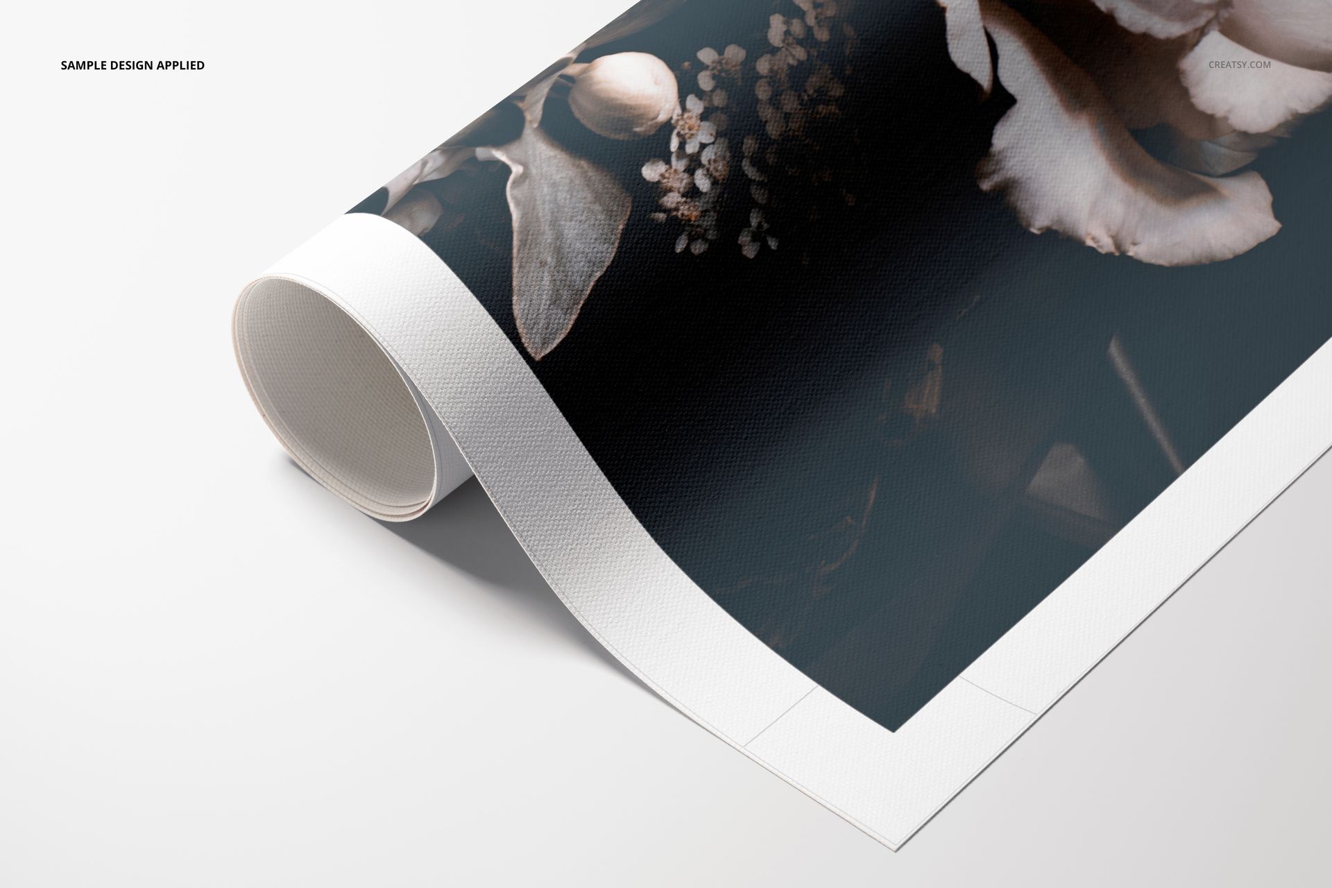 Close-up of a rolled canvas print mockup with a botanical pattern, displayed on a clean white background.