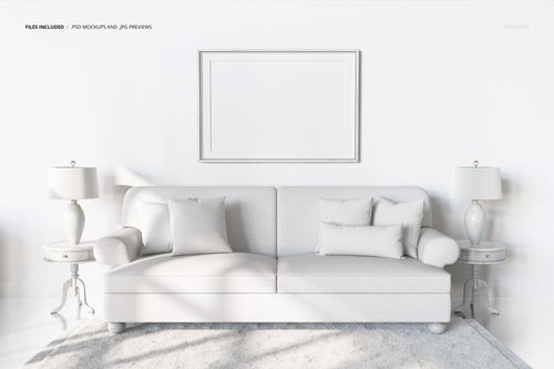 PSD mockup showing a light-colored sofa and pillows, set between matching lamps and tables in a clean, modern space.