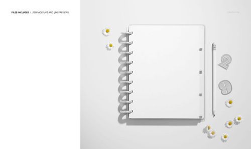 Top view of an open spiral planner mockup with blank dividers, pencil, paper clips, and scattered daisies.