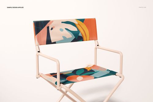 Mockup of a folding directors chair featuring geometric shapes in orange, teal, and cream, front view on white.