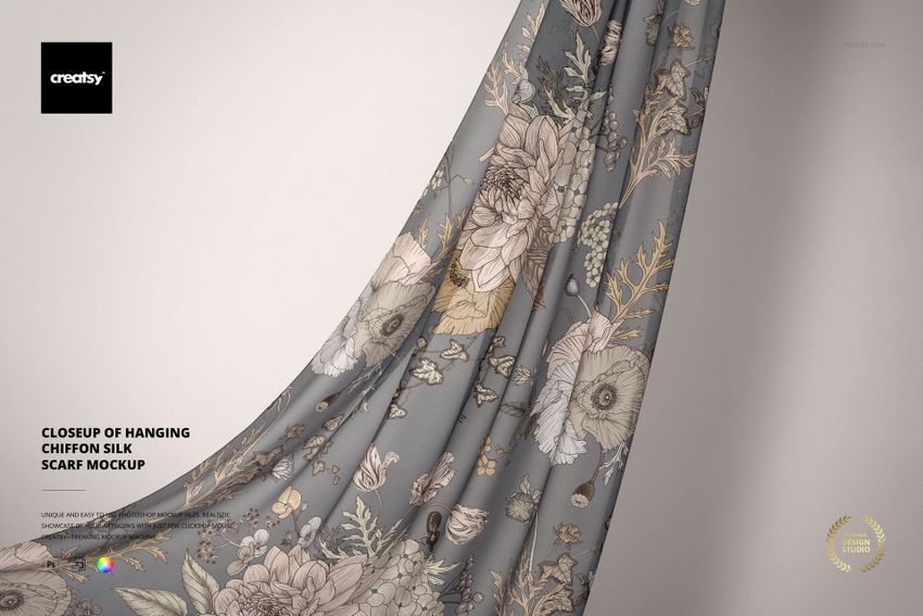Close-up view of a hanging chiffon silk scarf mockup featuring a delicate floral pattern on a soft gray background.
