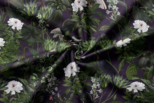 Tablecloth fabric mockup featuring a dark botanical pattern with green leaves and white flowers, viewed from above.