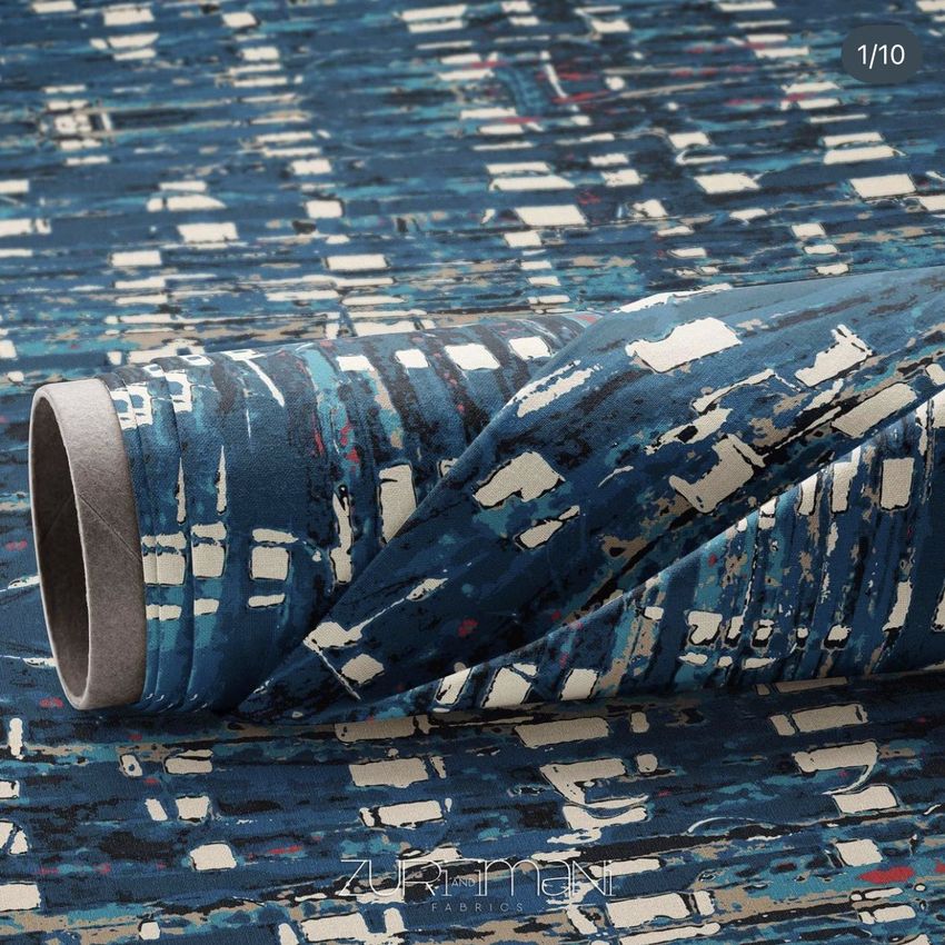 Fabric roll mockup featuring a blue and white abstract pattern, with the roll placed on matching patterned fabric.
