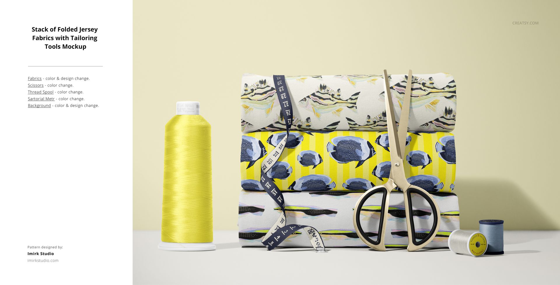 PSD mockup showing folded patterned jersey fabrics, scissors, measuring tape, and sewing thread on a neutral background.