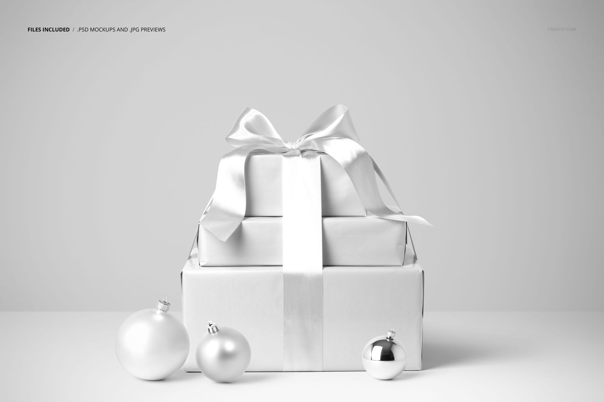 Christmas gifts mockup featuring neatly wrapped boxes and decorative baubles, arranged in a minimalist holiday scene.
