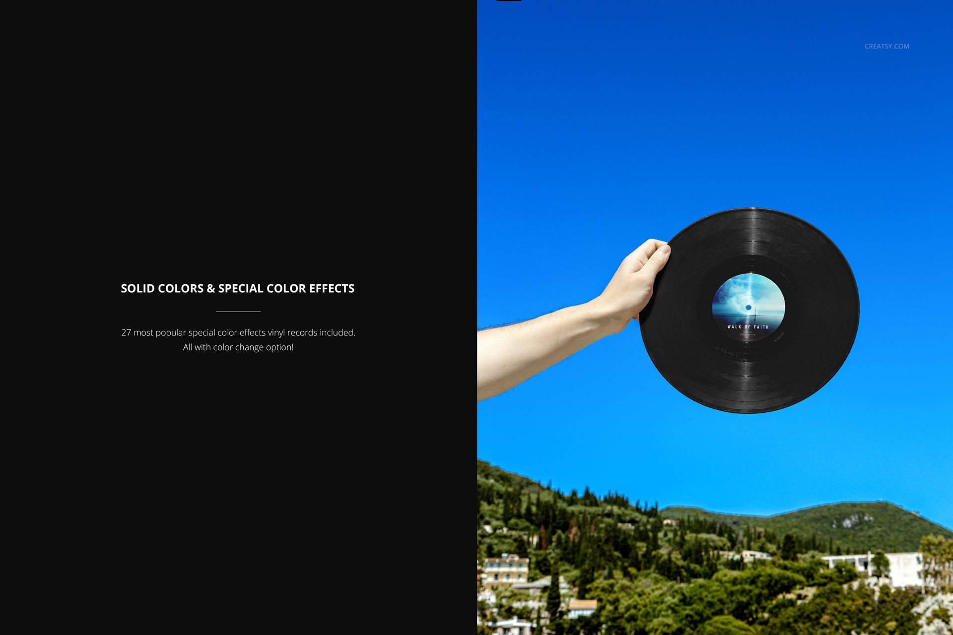 Black vinyl record mockup held by a hand against a clear blue sky and scenic Mediterranean hillside background.