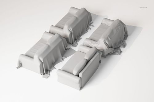 Four sofas covered with plain light gray throw covers, arranged on a white surface, viewed from an elevated angle.