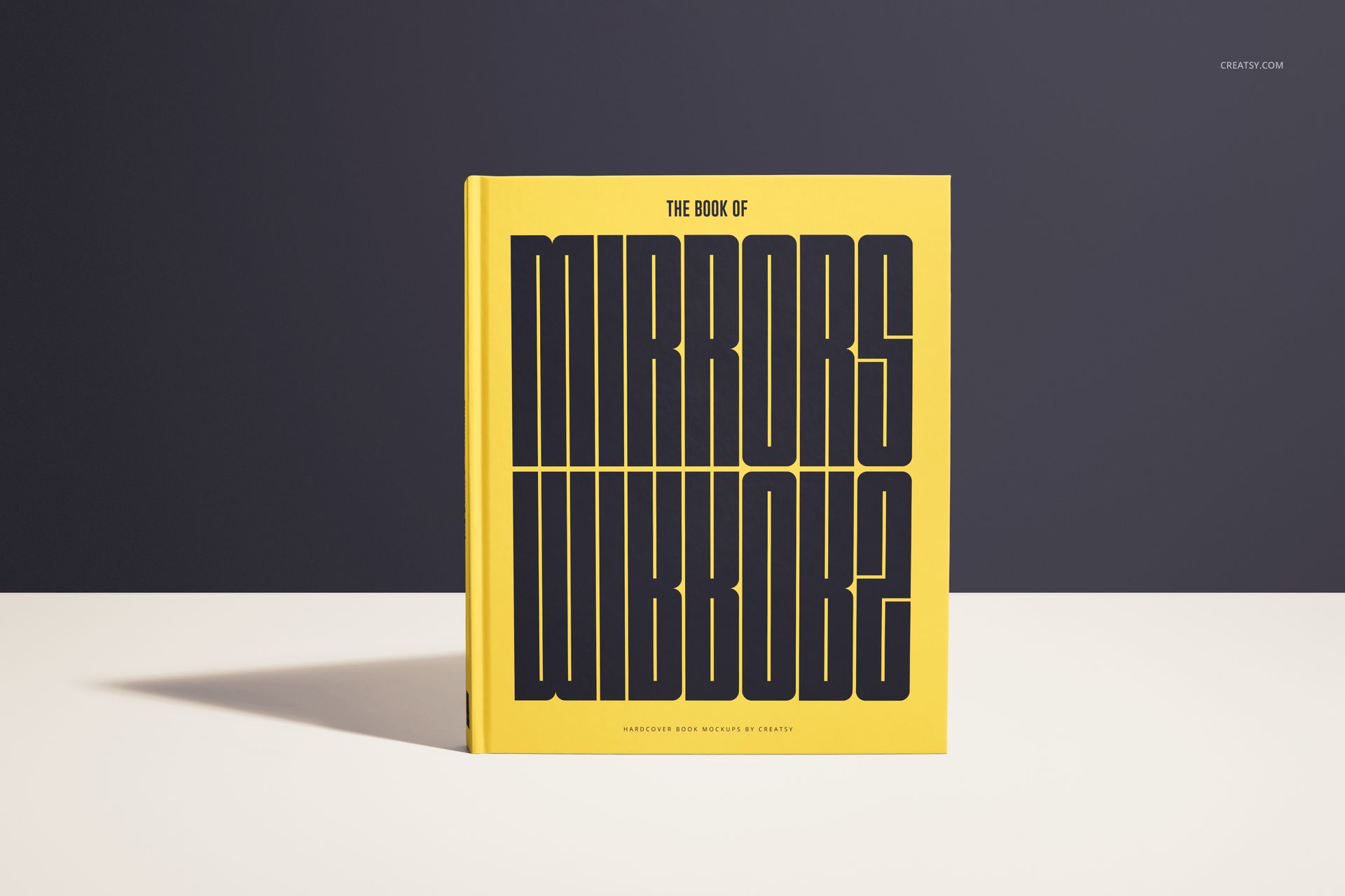 Front-facing hardcover book mockup featuring a yellow cover with large black text, placed on a flat white surface.