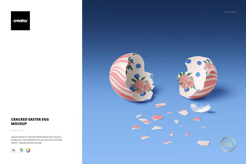 Front view of a cracked Easter egg mockup with pink stripes and floral patterns, fragments scattered on blue surface.
