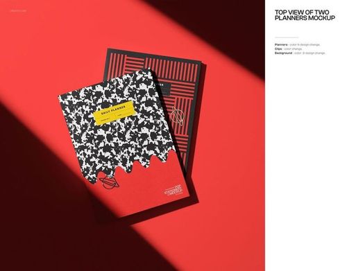 PSD mockup showing two planners on a bright red surface, with contrasting graphic patterns and strong shadows.