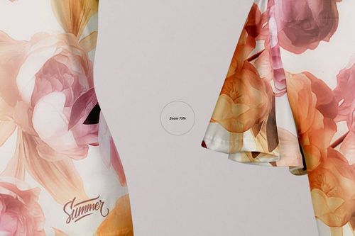 PSD mockup of an adult women's blouse with flowing sleeves, decorated with large peach and pink flowers on a pale surface.