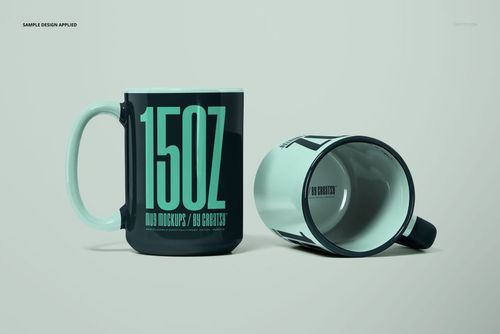 PSD mockup featuring two large mugs, one standing and one tipped over, with teal handles and bold teal text design.