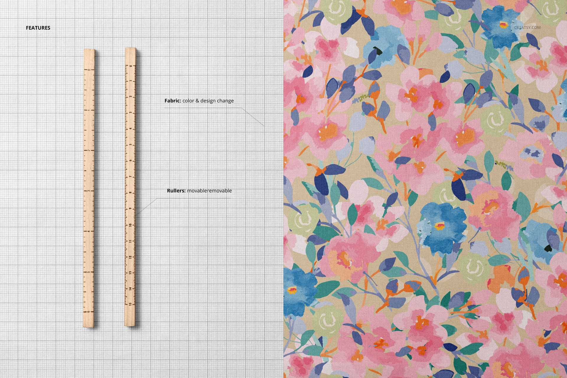Cotton fabric mockup featuring a vibrant watercolor flower design beside two wooden rulers, displayed from above.