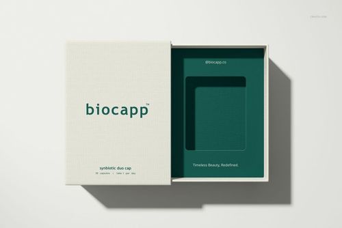 Rectangular packaging box mockup with lid partially removed, revealing a green insert tray and simple text.