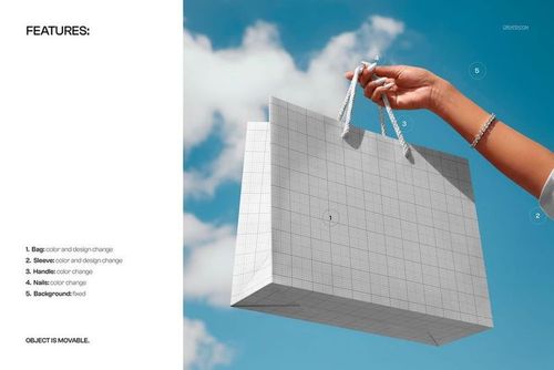 Paper shopping bag mockup with rope handles, held by a hand outdoors with clouds in the background.