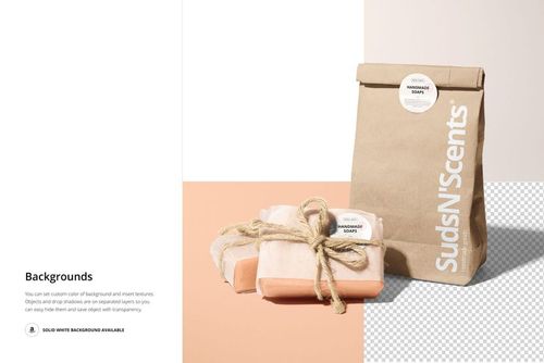 Front view of handmade soap packaging mockup with kraft paper bag and two wrapped soap bars tied with twine on a light background.