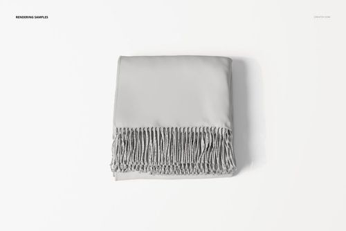 Folded throw blanket in solid light gray color with fringe detail, viewed from above on a white background.
