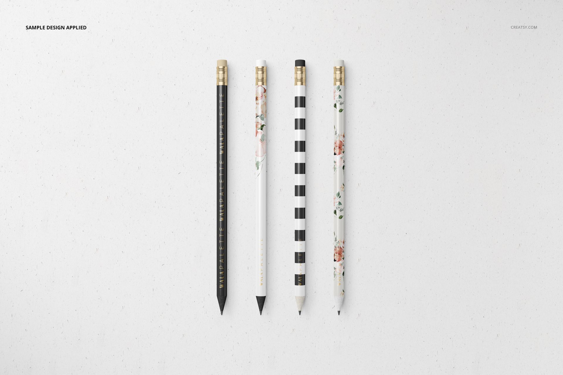 Stationery set mockup featuring four pencils with unique decorative prints, shown from a top view on a white background.